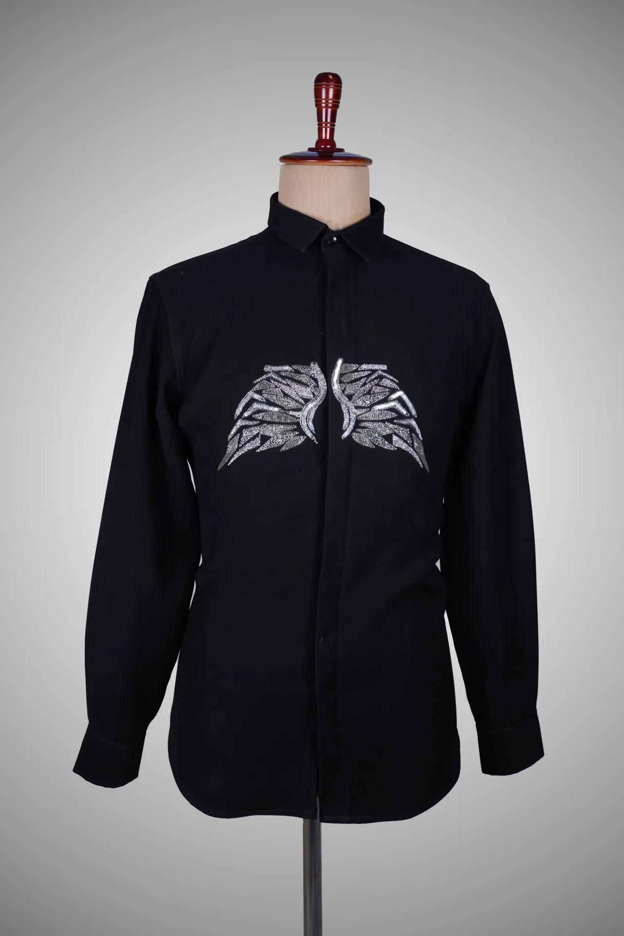 Black shirt with wings motif